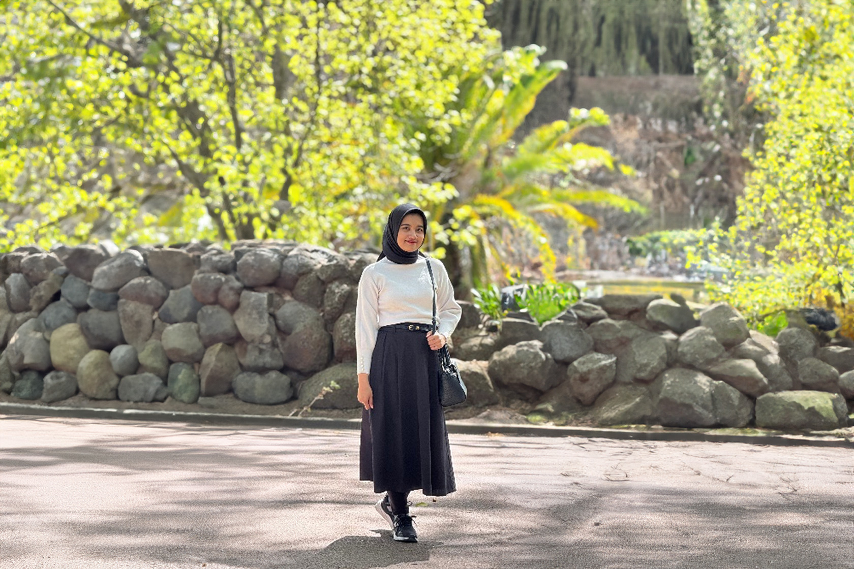 Ashanti takes a picture at Alexandra Garden, Melbourne, during spring season