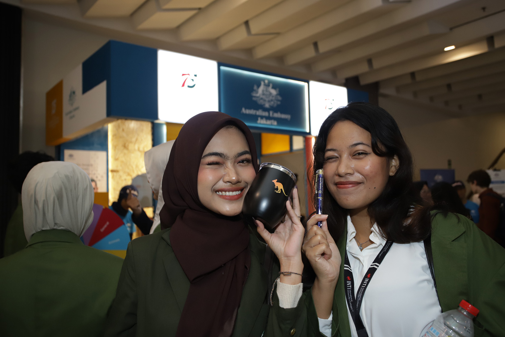 All smiles as the winner happily poses with their prize!  A well-earned reward for their fun and enthusiasm at the booth.