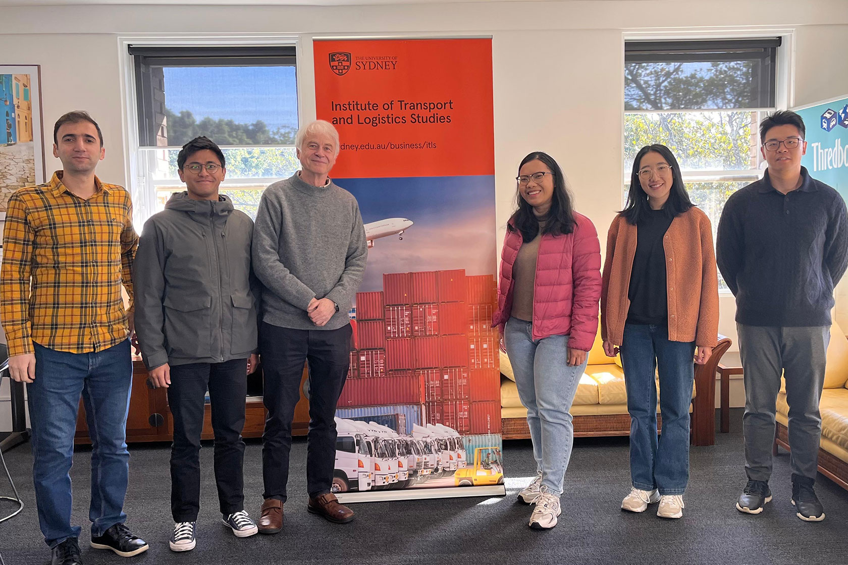 Erni and fellow students pose for a group photo with their research supervisor, Professor Michael Bell (third from left). He is a professor of Ports and Maritime Logistics at the Institute of Transport and Logistics Studies, University of Sydney.
