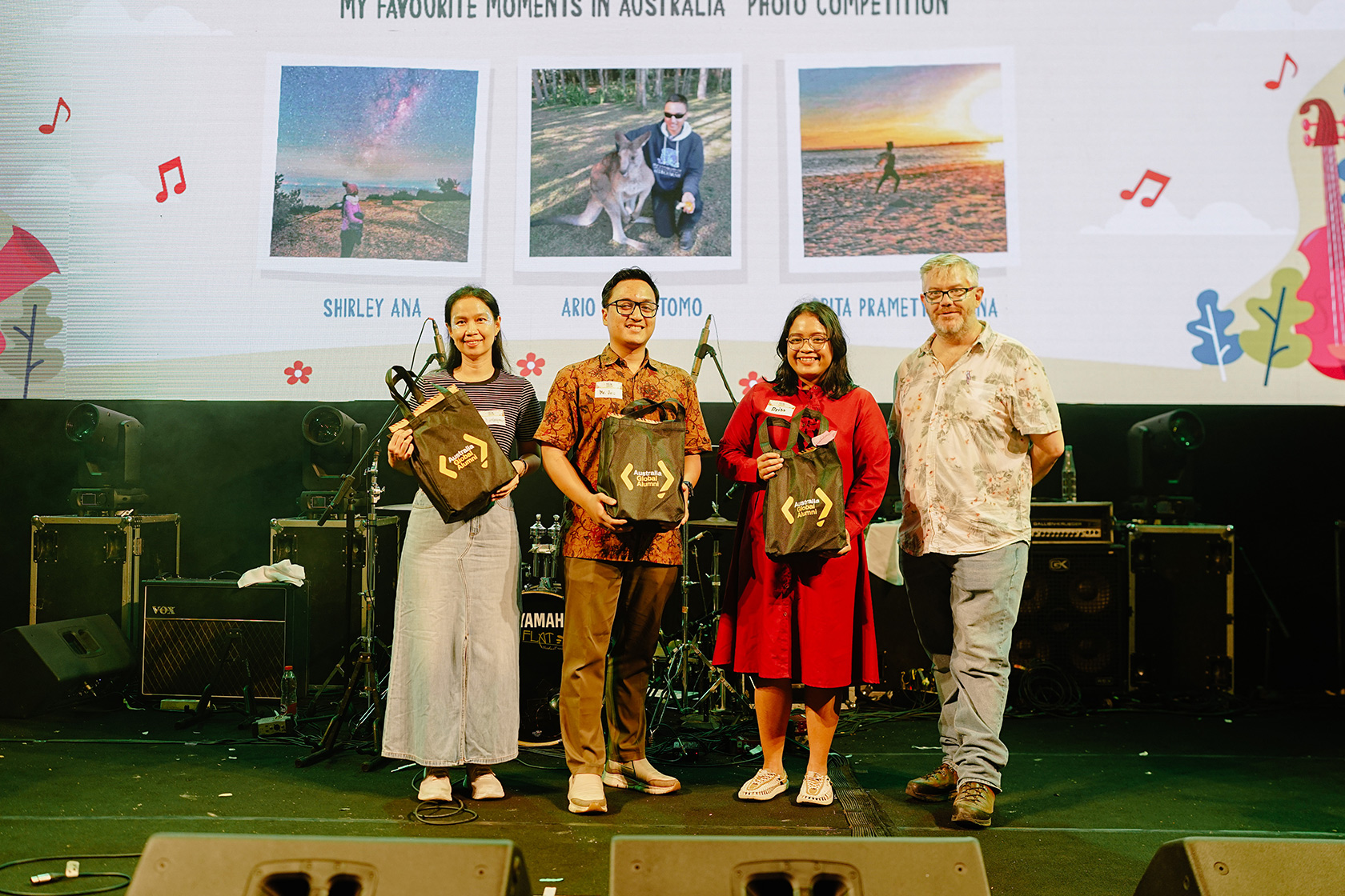 The winners of the “My Favourite Moments in Australia” Photo Competition receive prizes from Mr Anthony Clark.