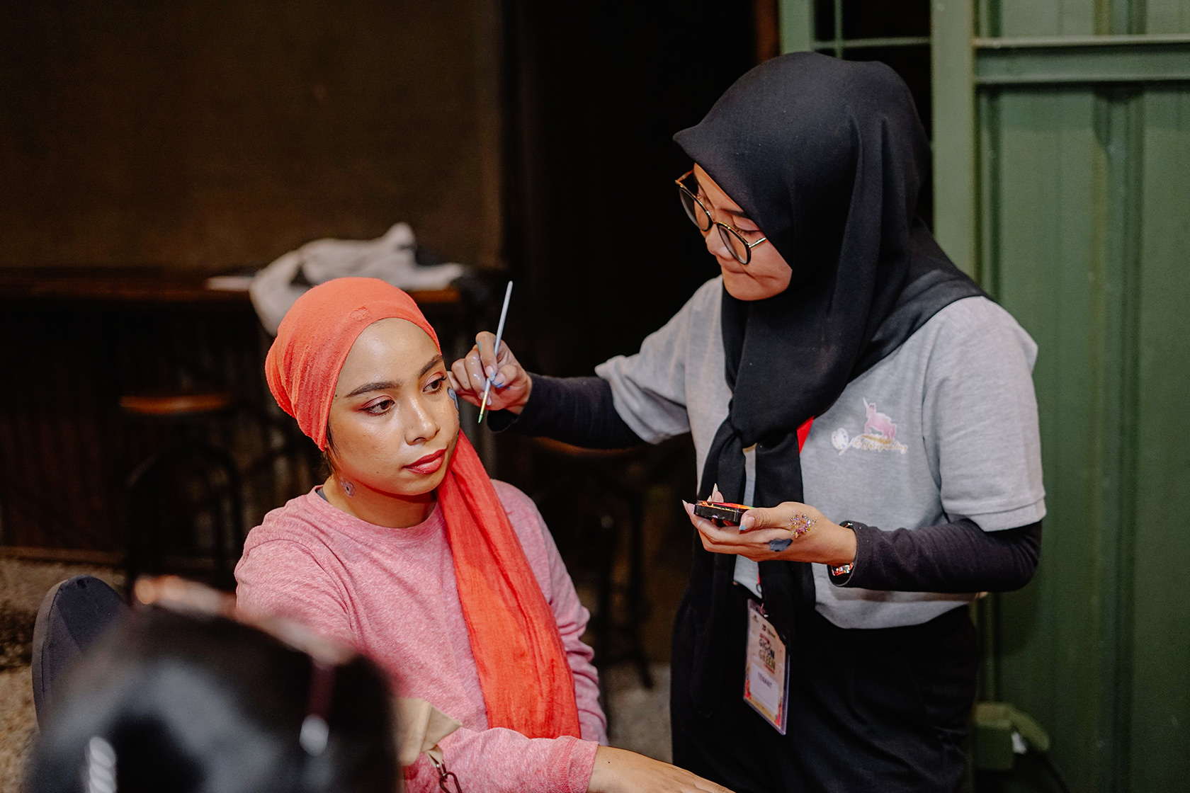 An alumna joins in the fun of festivities with face painting.