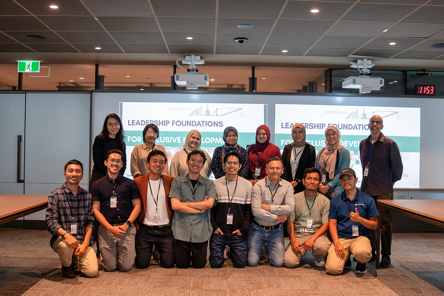 Participants from the Brisbane workshop pose for a group photo with the facilitator.