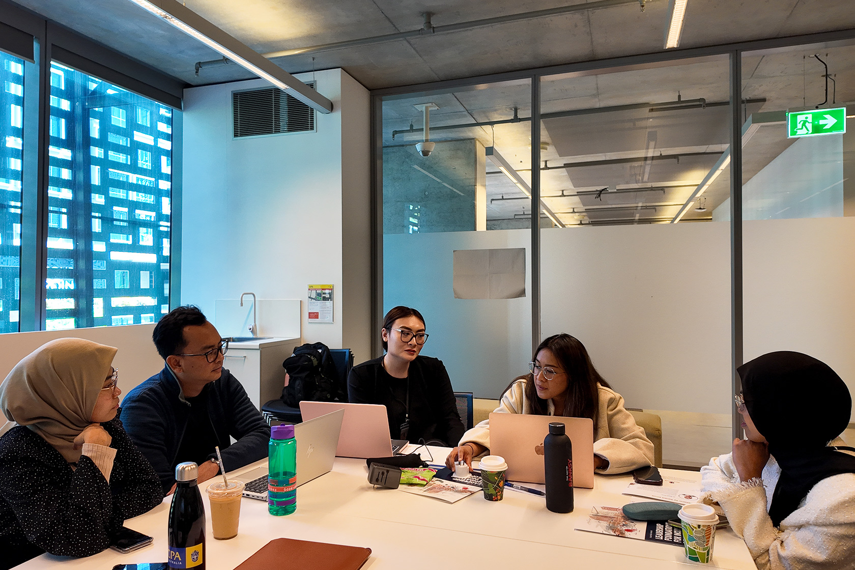 Participants of the Sydney workshop engage in dynamic discussions in one of the buildings at The University of Technology Sydney (UTS).