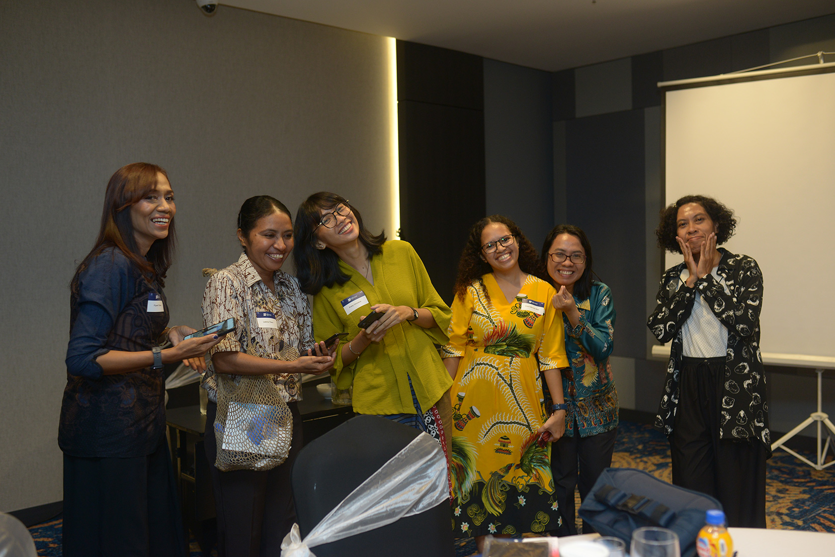 Alumni pose for a picture at the Alumni Networking Dinner in Sorong.