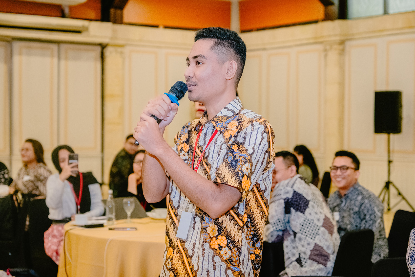 An Australia Awards scholar engages enthusiastically by asking a question during the PDB session.