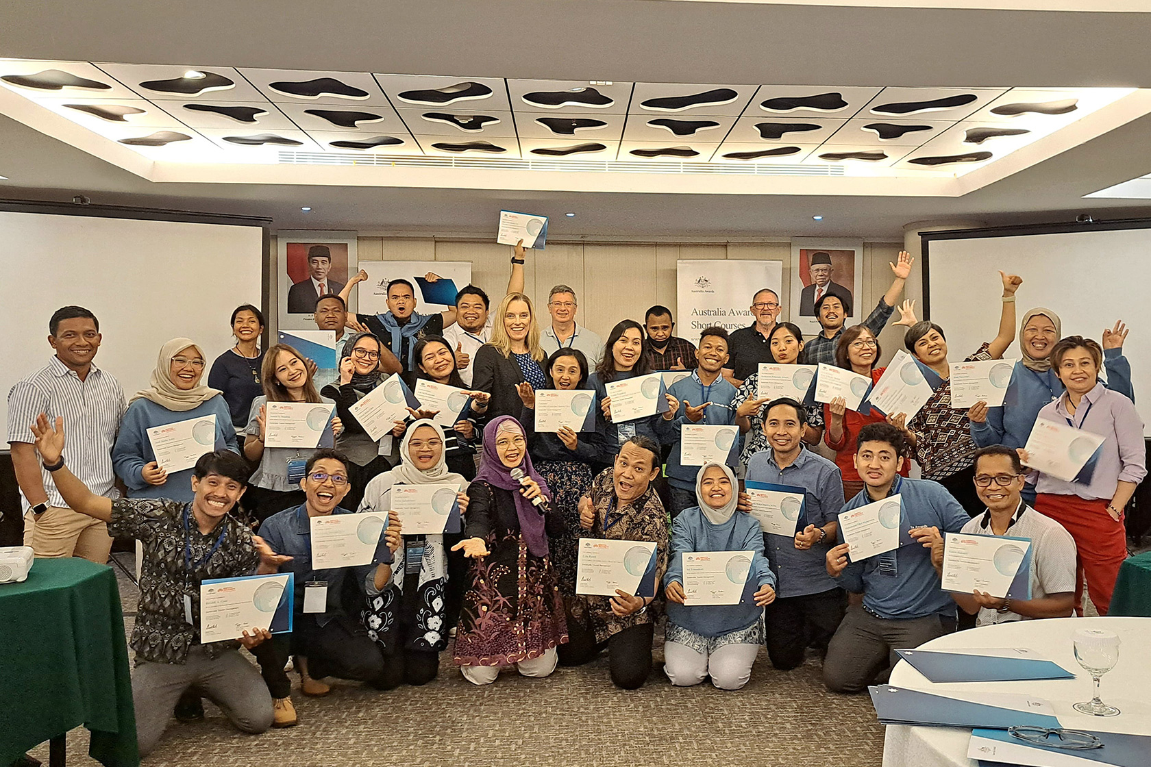 The course participants finishes the post-course workshop and exhibit the hard-earned course certificate, marking their status as the Australia Awards alumni.