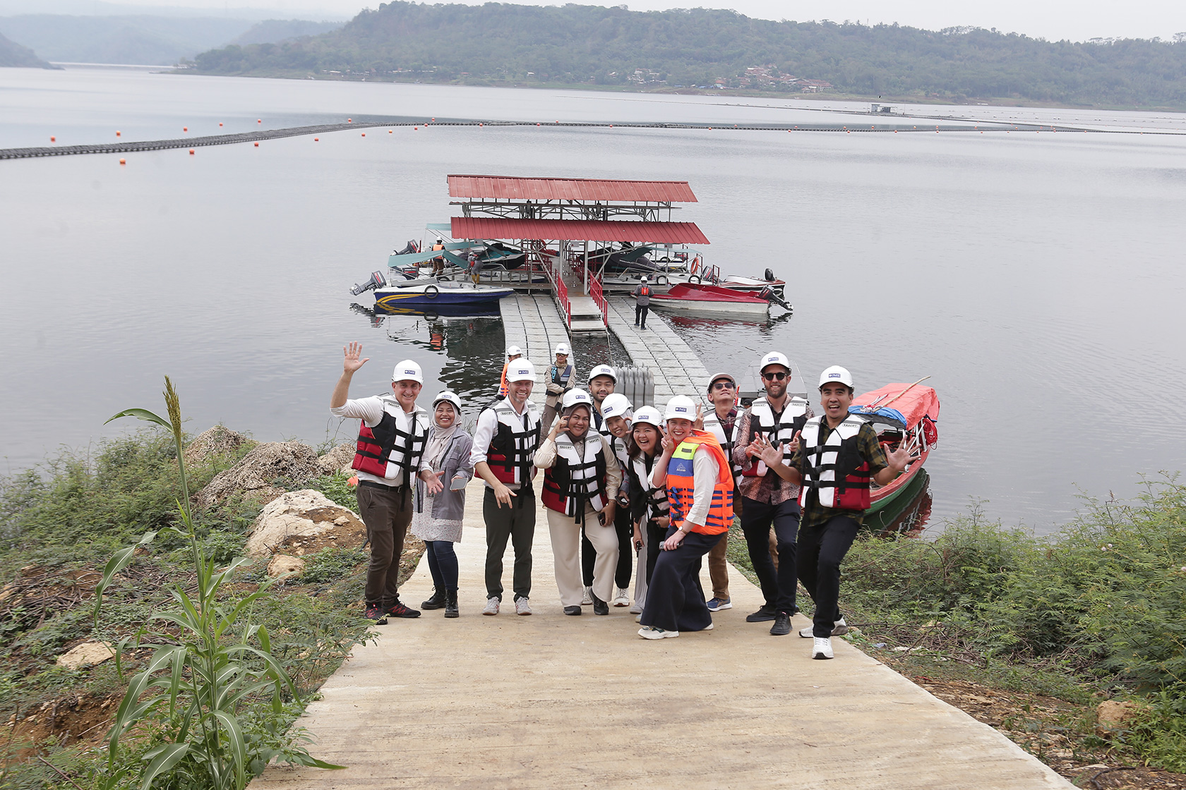 Participants pose together in front of the Cirata Solar Power Plant.