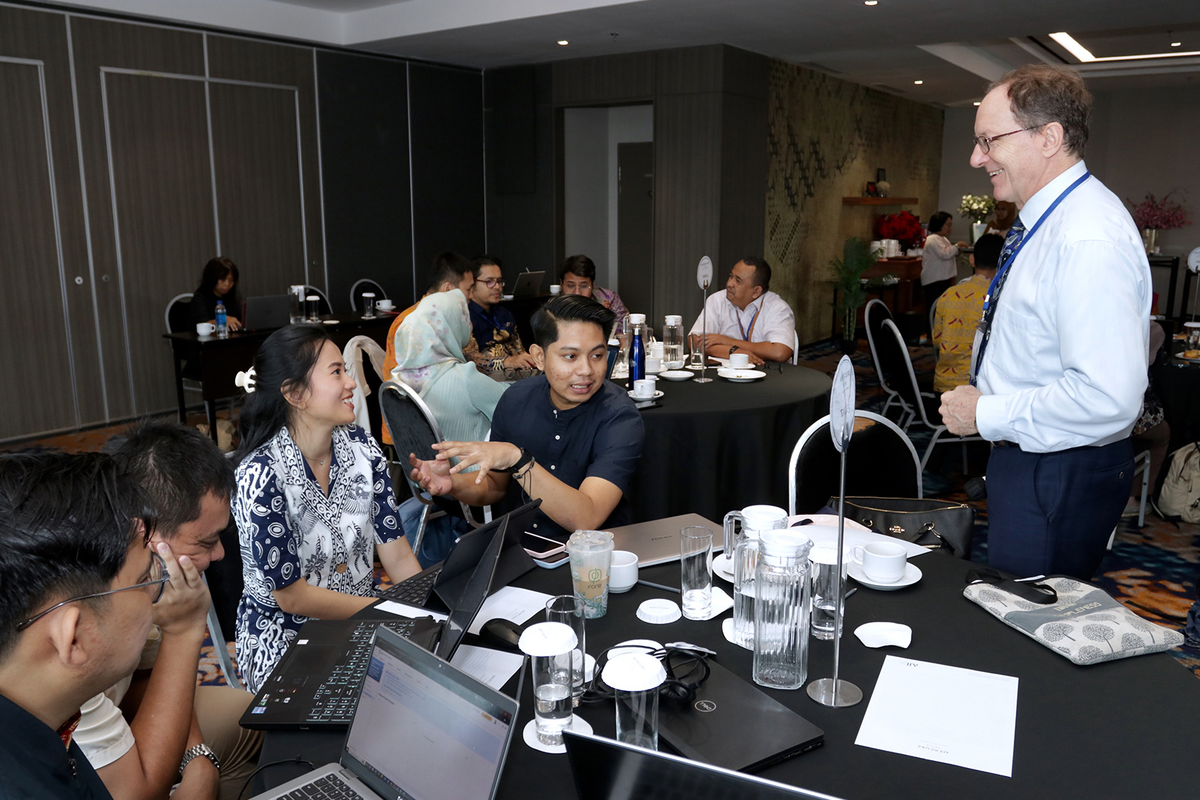 Mr Laode M. Syarif joins an engaging discussion with participants and the course facilitator, exchanging enlightening ideas.