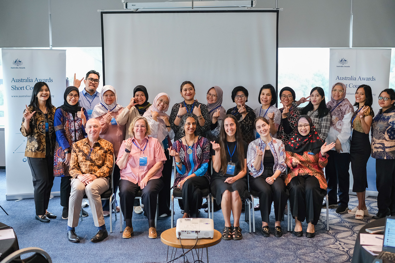 Participants happily pose for a group photo with Australian Deputy Ambassador to Indonesia, Ms Gita Kamath. 