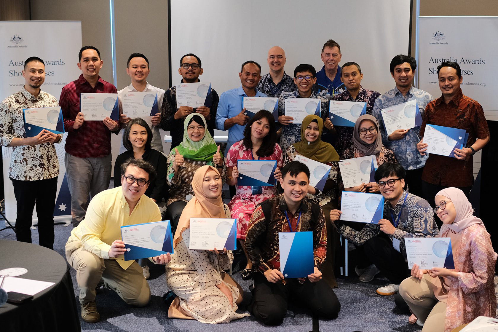 All participants, committee, course leaders, and facilitators happily take a group picture together