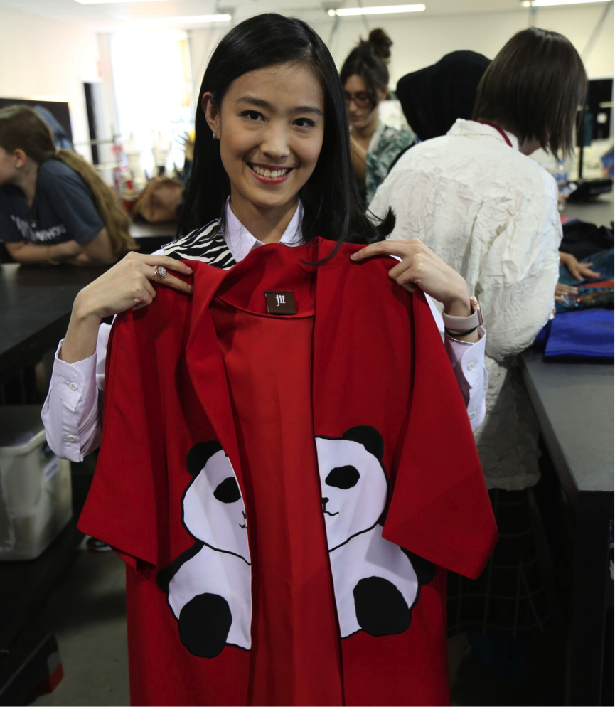 Gloria Agatha, the designer behind Jii, with one of her pieces (photo by QUT Creative Industries).