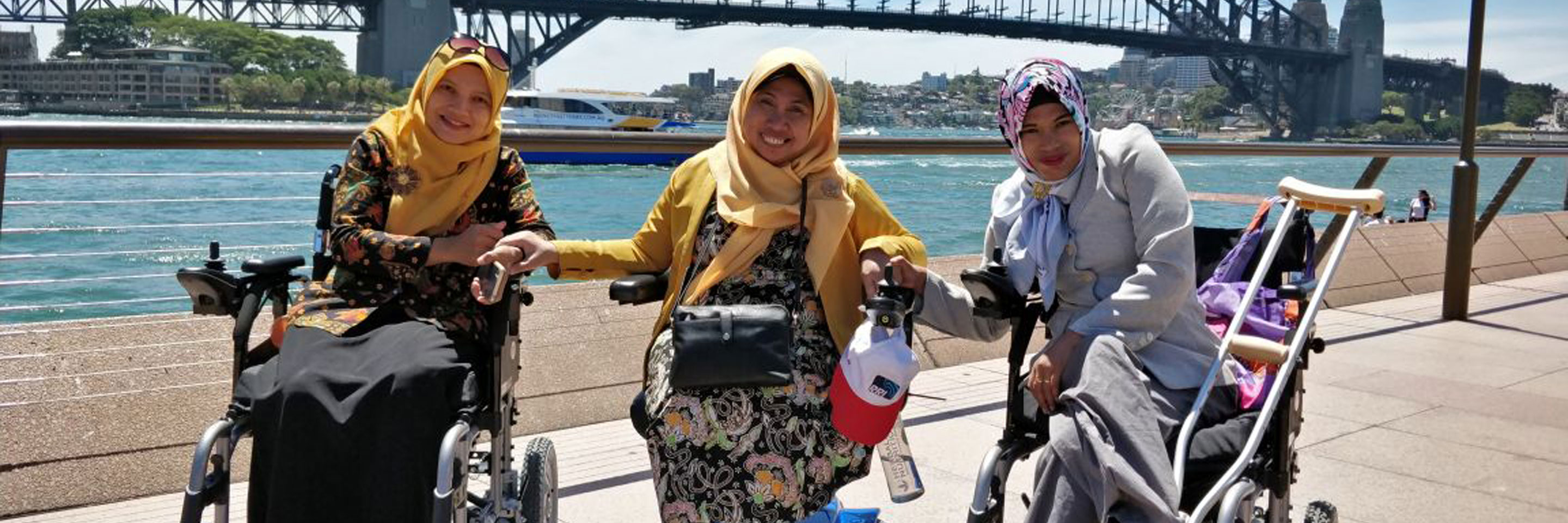 Three aspiring women at Sydney Harbour Bridge during the Organisational Leadership and Management Practices for Disabled People’s Organisations Short Term Award.